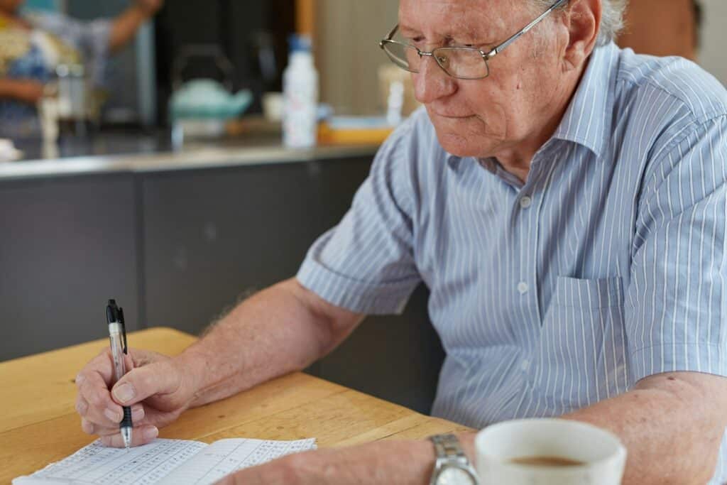 A farmer reviewing profitability documents at a table