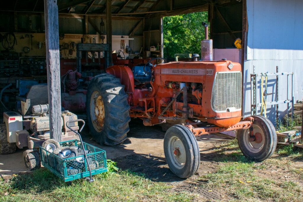 a new tractor parked in front of a shed, after receiving a grant